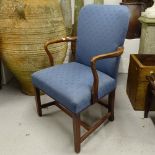 An early 20th century upholstered open arm desk chair