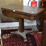 A Regency rosewood fold over card table, raised on barrel turned column and platform base, W92cm,