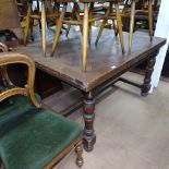 A 1930s parquetry-topped draw leaf dining table, on baluster turned legs, W130cm, H75cm