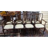 A set of 8 Edwardian mahogany dining chairs, with upholstered seats, on shaped cabriole legs