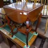 An Edwardian mahogany quadruple drop leaf occasional table, on shaped cabriole legs, with raised