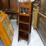 A Liberty's of London mahogany and satinwood-strung narrow open bookcase, with leadlight glazed