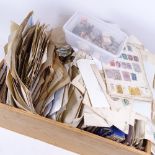 A box of postage stamp albums, loose stamps etc