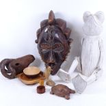 An articulated carved and painted frog, a Tribal mask, 40cm, a carved rams head, and various treen