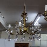 A gilt-metal 5-branch chandelier with lustre drops