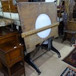 A Vintage Architect's adjustable drawing table, with later fitted light fitting