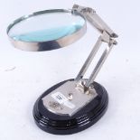 A reproduction desk top anglepoise magnifying glass, by Watts & Sons Ltd of London, magnifier