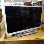 A Sharp 32" flat screen TV (no remote)