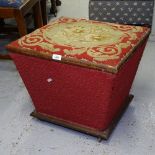 A Victorian concave ottoman of small size, with needlework rising lid, W50cm