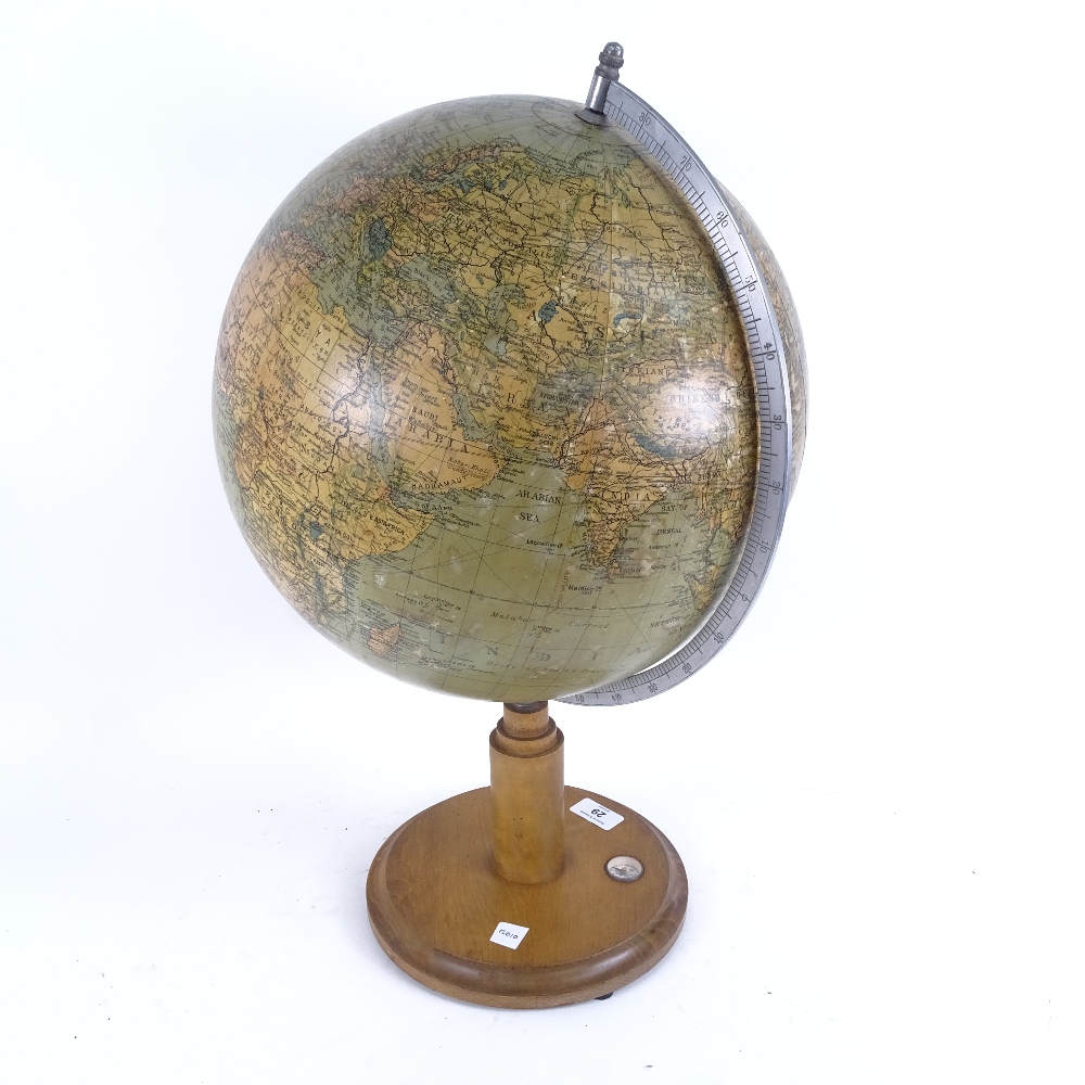 An early 20th century terrestrial globe, by James Wellsworth Ltd, on compass inset stand, overall