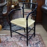 A 19th century Aesthetic ebonised and gilded armchair, in the manner of Godwin