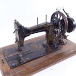 An early 20th century German Frister & Rossman of Berlin mahogany-cased sewing machine, in inlaid