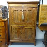 A late 19th century Continental flame veneered mahogany escritoire, with frieze drawer, fall-