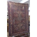 A 19th century red ground Afghan rug, 175cm x 120cm