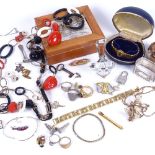 A quantity of costume jewellery, a scent bottle, jewel box with embossed silver top etc