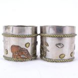 A pair of American Aesthetic Movement tri-metal barrel salts, relief sealife decoration, height 4.