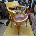 A Victorian light oak desk chair, with studded leather seat