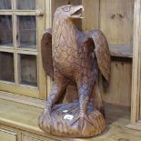 A carved hardwood study of an eagle, H52cm