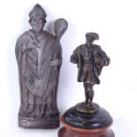 A small bronze sculpture of a Tudor man, and another religious plaque, sculpture overall height 15cm