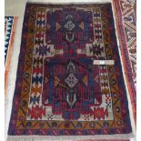 A Beluchi blue ground rug, 141cm x 90cm