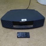 A Bose Wave music system, model AWRCC5, with remote control, GWO