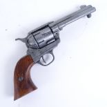 An Italian replica Colt revolver, 4" cylindrical barrel with steel frame and hardwood grips