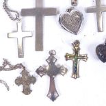 A collection of silver crucifixes, and heart design jewellery