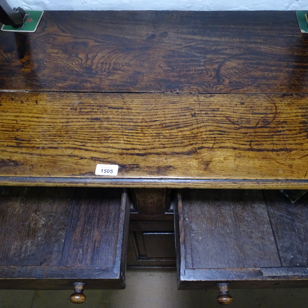 An Antique joined oak dresser base, with frieze drawers and fielded panelled cupboards, on stile - Image 2 of 2