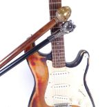 An electric guitar, and 2 modern walking canes (3)