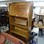 A 1920s oak student's bureau, W72cm, and a book trough