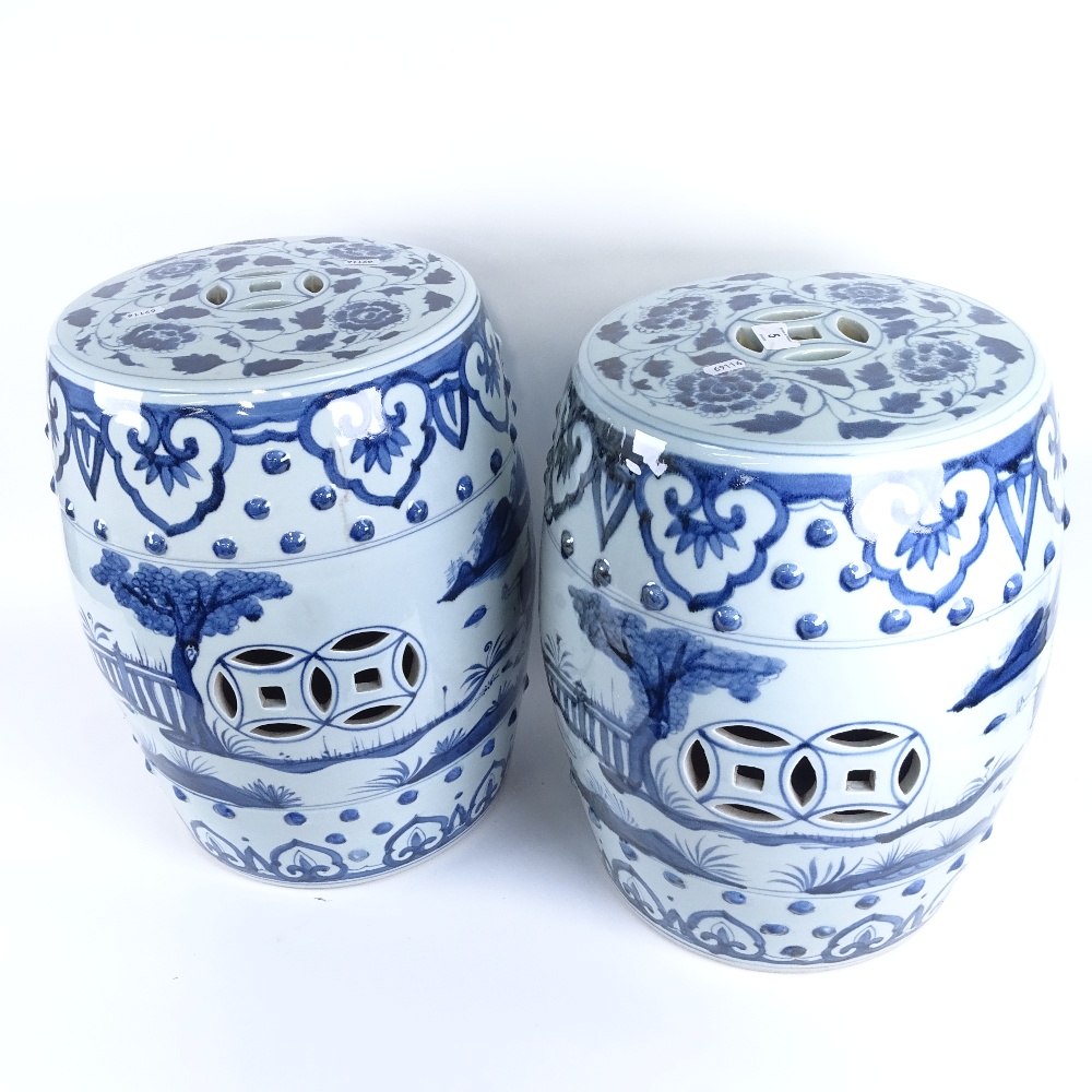 A pair of Chinese blue and white porcelain barrel garden seats, pierced panels with figural and - Image 2 of 2