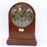 An early 20th century German mahogany-cased dome-top 8-day chiming mantel clock, brass backplate