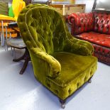 A Victorian buttoned-back upholstered armchair, on turned mahogany legs