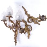 A group of French gilt-brass foliate wall light fittings, with frosted glass flaming torch shades,