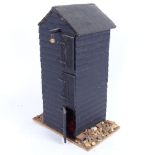 A handmade Hastings fishing hut, complete with contents and lobster cages, height 28cm