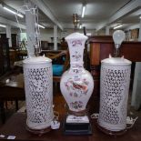 A pair of Oriental design Blanc-de-Chine table lamps with pierced bodies (central lamp no longer in