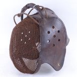 An Italian 19th century iron and leather fencing mask, no maker's marks