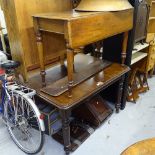 A Victorian mahogany wind-out dining table with 2 spare leaves, a Victorian mahogany Sutherland