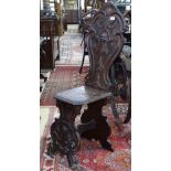 An Italian carved pine side chair