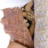 Paisley bed cover, roll of snakeskin, and a foot cushion (3)