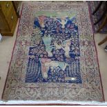 An Antique red ground Persian rug, with figural decoration, 197cm x 136cm