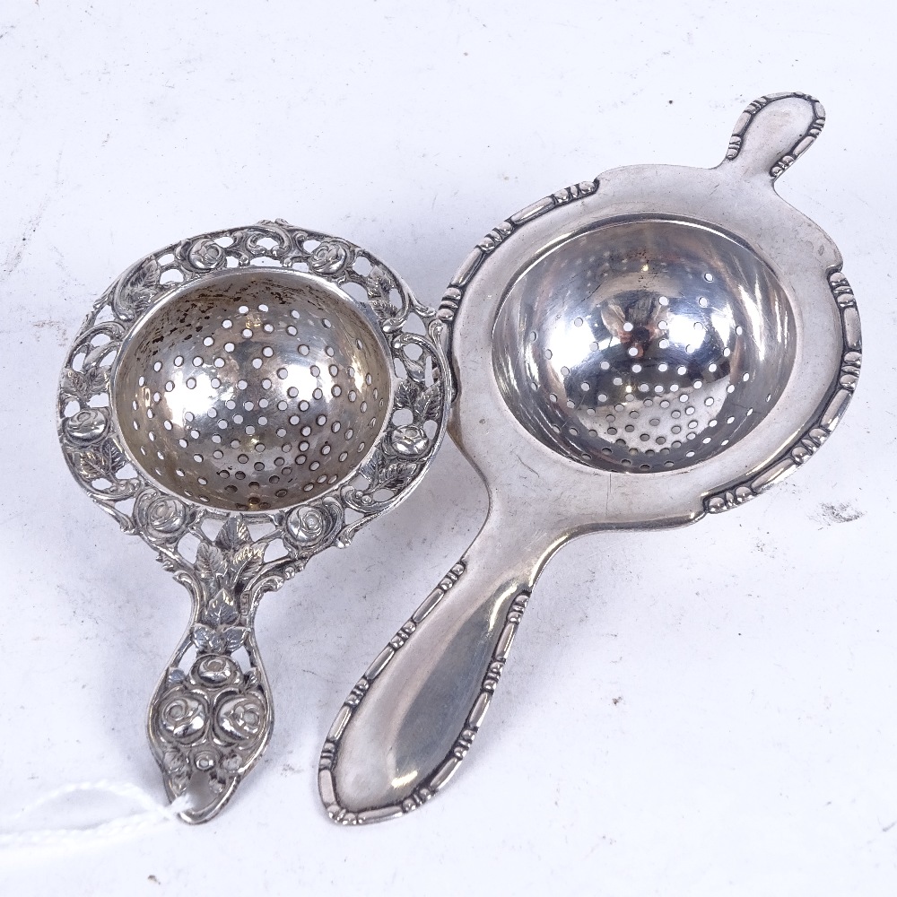 2 silver tea strainers, 1 Danish dated 1920, the other Swedish stamped 830