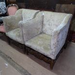 A pair of early 20th century upholstered armchairs, with carved Carolean style stretchers