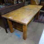 A solid oak rectangular dining table with 2 spare leaves, raised on square legs, L180cm extending to