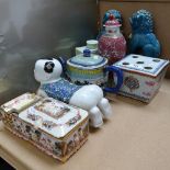 A pair of Chinese blue glaze Dogs of Fo, armorial brush pot, celadon glaze tea caddy etc