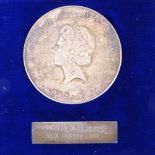 A limited edition Queen Elizabeth II Silver Jubilee commemorative silver medal, no. 3598/5000, by
