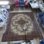 A large cream and red ground Tabriz design carpet, 360cm x 275cm