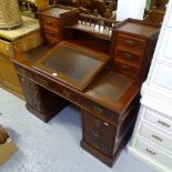 A late Victorian mahogany writing desk, with raised drawer-fitted superstructure and slope with
