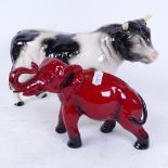 A Royal Doulton Flambe elephant, and a Melba Ware bull, largest length 30cm (2)