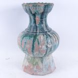 A Chinese Han Dynasty terracotta vase, traces of original green glaze finish, height 38cm, rim